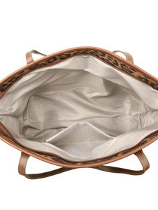 Detail showing the herringbone fabric lining and zippered inner pocket of the leopard tote bag