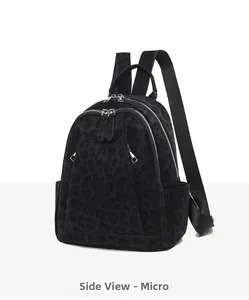 Side view of black leopard print backpack featuring premium suede texture and dual zippers