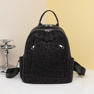 Chic black leopard print backpack with silver hardware for women in a modern college style