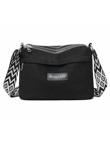 Close-up of waterproof nylon bag with multi-zipper layers and geometric pattern strap