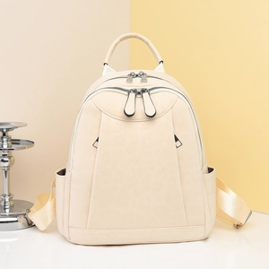 Elegant cream leopard print backpack with silver zippers and adjustable straps for women