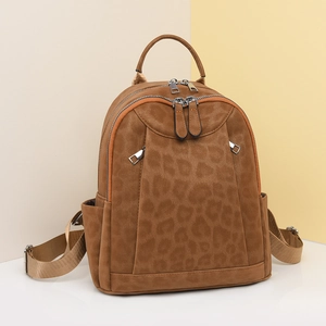 Stylish leopard print backpack in brown faux suede with adjustable straps and front pocket
