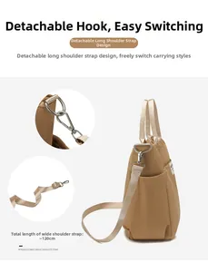Detail of khaki nylon tote bag with 120cm detachable wide strap and metal hooks
