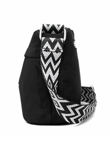 Close-up of black nylon shoulder bag with black and white geometric wide strap and silver hardware