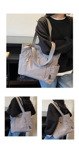 Detail view of large light purple nylon tote bag with multiple pockets for daily commute