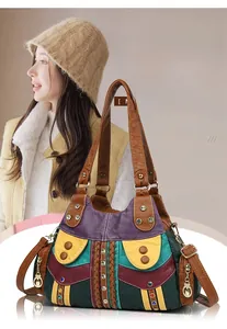 Detail of bohemian retro patchwork tote bag with colorful leather blocks and vintage studs