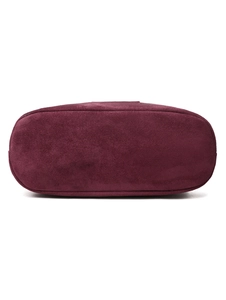 Detailed base view of the burgundy waterproof nylon bag with oval bottom construction