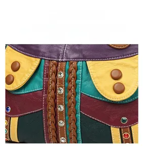 Detail of multi-color patchwork leather tote with rhinestones and woven trim