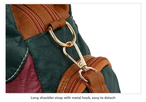 Detail of multi-color leather texture with gold hardware hooks for removable shoulder straps