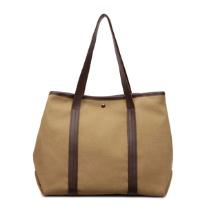 Large khaki canvas tote bag with brown leather handles and a secure metal buckle