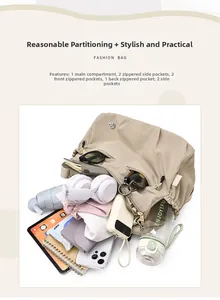 Nylon shoulder bag interior showing multiple pockets for tablet, umbrella and daily items