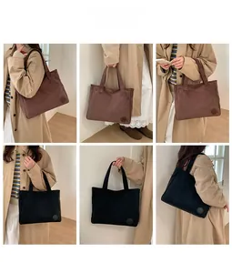 Detail shots of corduroy tote bags in black and dark coffee colors on a model
