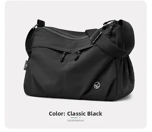 Detailed view of water-resistant black nylon crossbody bag with multi-zipper pockets