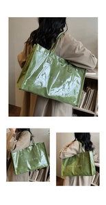 Close-up of green dual-layer tote bag with transparent PVC shell and paper-textured lining
