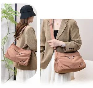 Detailed view of waterproof nylon crossbody bag with multi-zipper layers for women