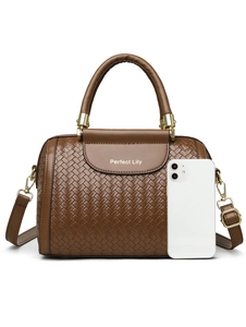 Detail of brown woven texture Boston bag with gold hardware and phone for size reference