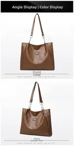 Macro detail of the woven PU leather texture and brand label on a brown tote bag