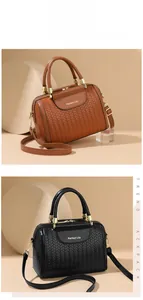 Detail of woven leather texture and gold hardware on stylish bucket bags in black and brown