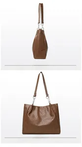 Detail view of woven brown PU leather tote bag with silver chain straps and side profile