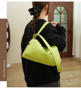 Fluorescent green lychee texture leather shoulder bag shown on model for size and style