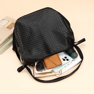 Black woven leather backpack with large capacity storage for tablets and essentials