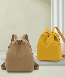 Detail view of the durable nylon fabric and branding on these water-resistant backpacks