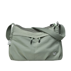 Waterproof nylon crossbody bag in sage green featuring multiple zipper pockets and strap
