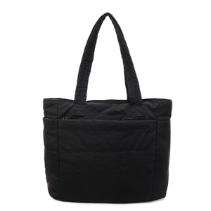 Large black quilted tote bag with wide straps for stylish daily commute or casual use