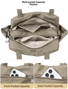 Detail view of khaki nylon crossbody bag featuring multi-layer zipper and pocket storage