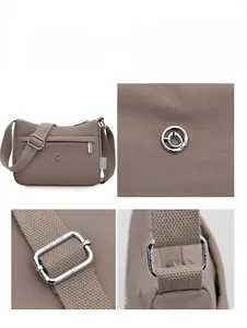Macro detail of brown nylon crossbody bag featuring silver hardware and adjustable strap