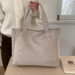 Minimalist beige suede tote bag with large capacity and elegant shoulder straps