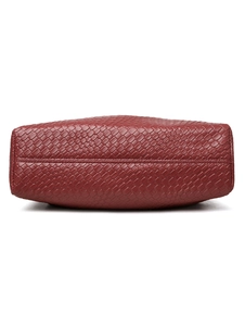 Close-up of burgundy woven PU leather tote bag base with reinforced stitching