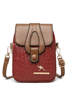 Detail of burgundy woven crossbody bag with gold kangaroo logo and smooth leather flap