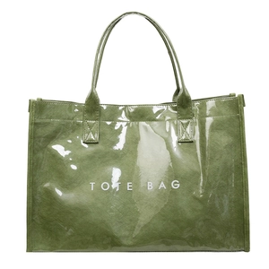 Modern glossy green Tyvek tote bag with white TOTE BAG lettering on a white background