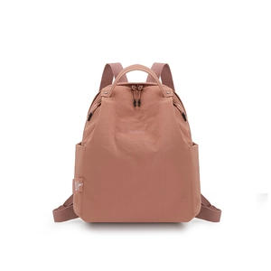 Detail of mauve pink waterproof nylon backpack with top handle and side pocket storage