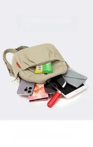Macro view of beige nylon backpack interior with multi-layer storage for tablets