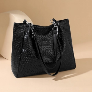 Large black woven PU leather tote bag with silver chain straps and stylish texture
