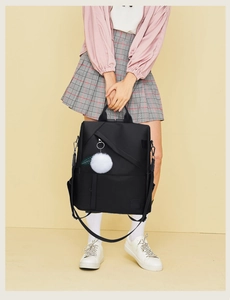 Detail of waterproof Oxford cloth backpack with anti-theft back zipper and plush ball