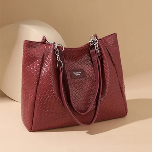 Chic burgundy woven PU leather tote bag with elegant silver chain and shoulder straps