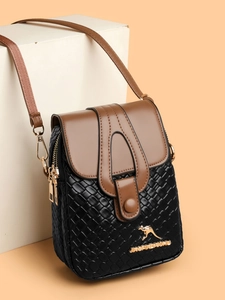 Detailed close-up of woven texture and kangaroo emblem on a dual-tone crossbody bag