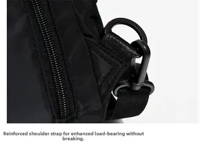 Reinforced shoulder strap stitching and durable D-ring detail on black travel backpack