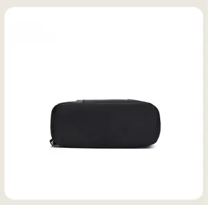Detail view showing the reinforced bottom of this black oxford cloth travel backpack