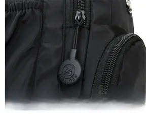 Detail of durable black nylon backpack featuring smooth zipper with YIMEISEN rubber puller