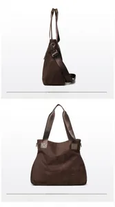 Detail view of large dark coffee suede tote bag with adjustable wide strap and side zipper