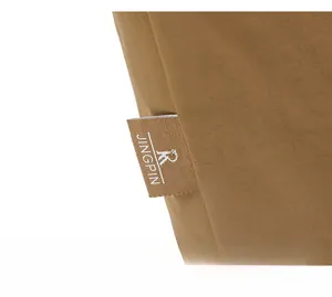 Close-up of a brown nylon backpack with high-quality brand woven label and texture