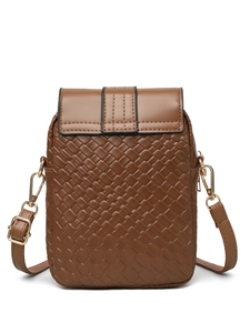 Detail of brown woven texture crossbody bag with gold buckle and adjustable strap