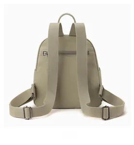 Back view of gray-green nylon backpack featuring hidden anti-theft zipper and wide straps