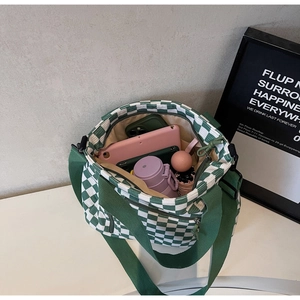 Interior view of checkered tote bag showing large capacity for tablet and essentials