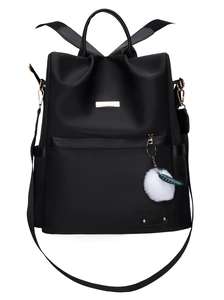 Zaino nero da donna in tessuto Oxford con pompon e dettagli di cerniere dorate lucide