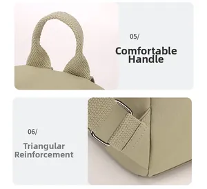 Detail of canvas backpack showing reinforced triangle stitching and durable webbing handle